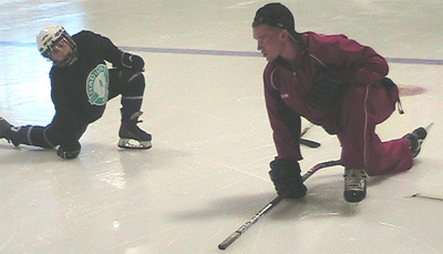 Radius Edge Power Skating instructor Billy Kingdon is closely watched by a student
