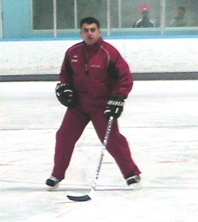 Radius Edge Power Skating on ice program director Joe Cicolini demonstrates proper form and technique for backwards skating
