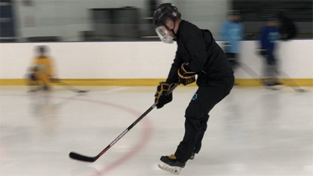 Radiius Edge Power Skating instructor Dante Goldner demonstrates a Heel Stops exercise at a Radius Edge Power Skating clinic